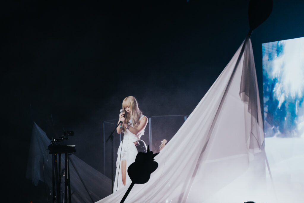 Creating a Dreamscape: Wisp’s Mythic Coachella set made with Superstudio 6 A photograph of Wisp performing at Coachella 2025